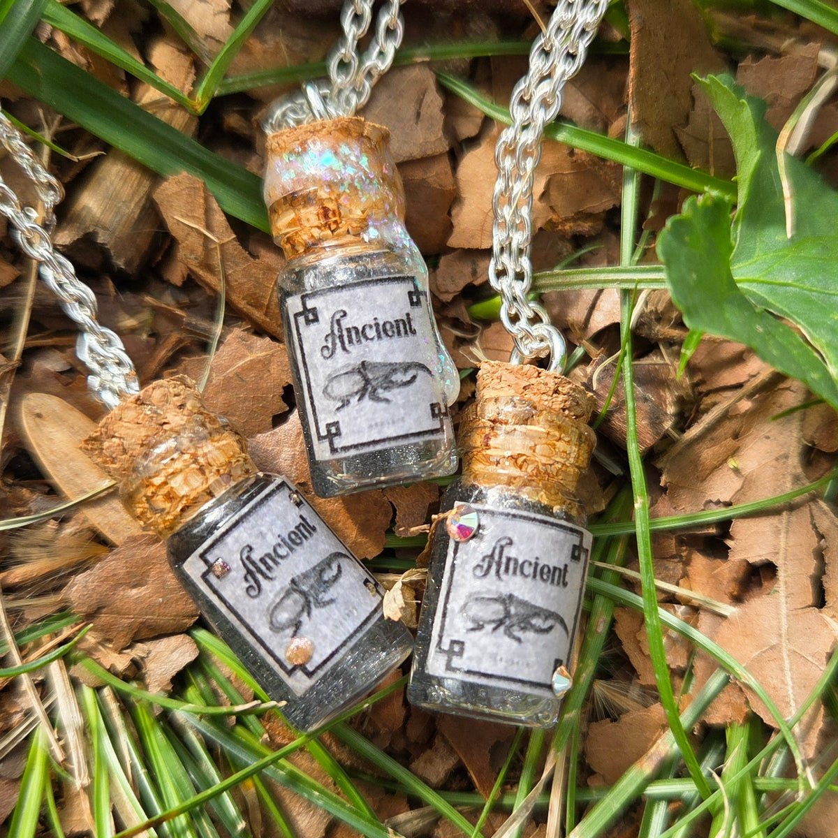 'Ancient Beetle' Individual Handmade Black Glittery Mini Liquid Potion Bottle Necklaces