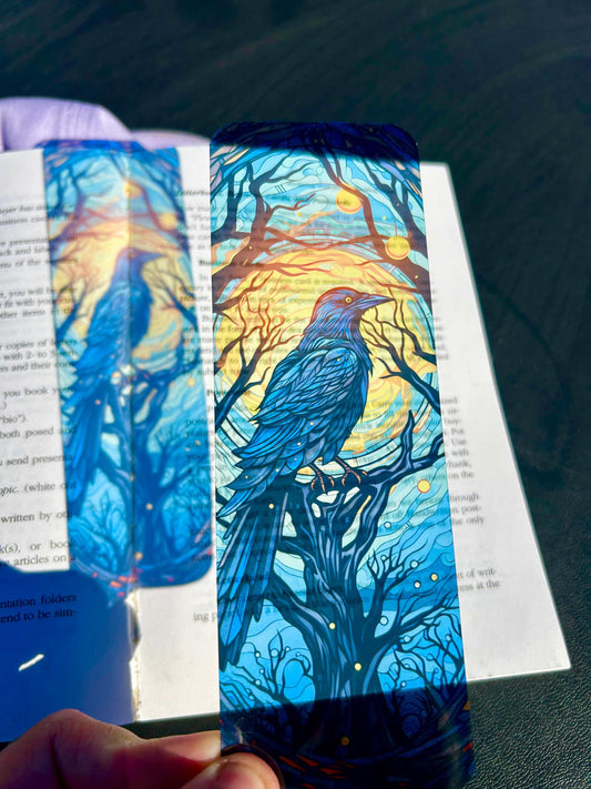 Gothic raven bookmark with stained glass arch, sunset skies and vintage pedestal, dark fantasy bird art for moody readers