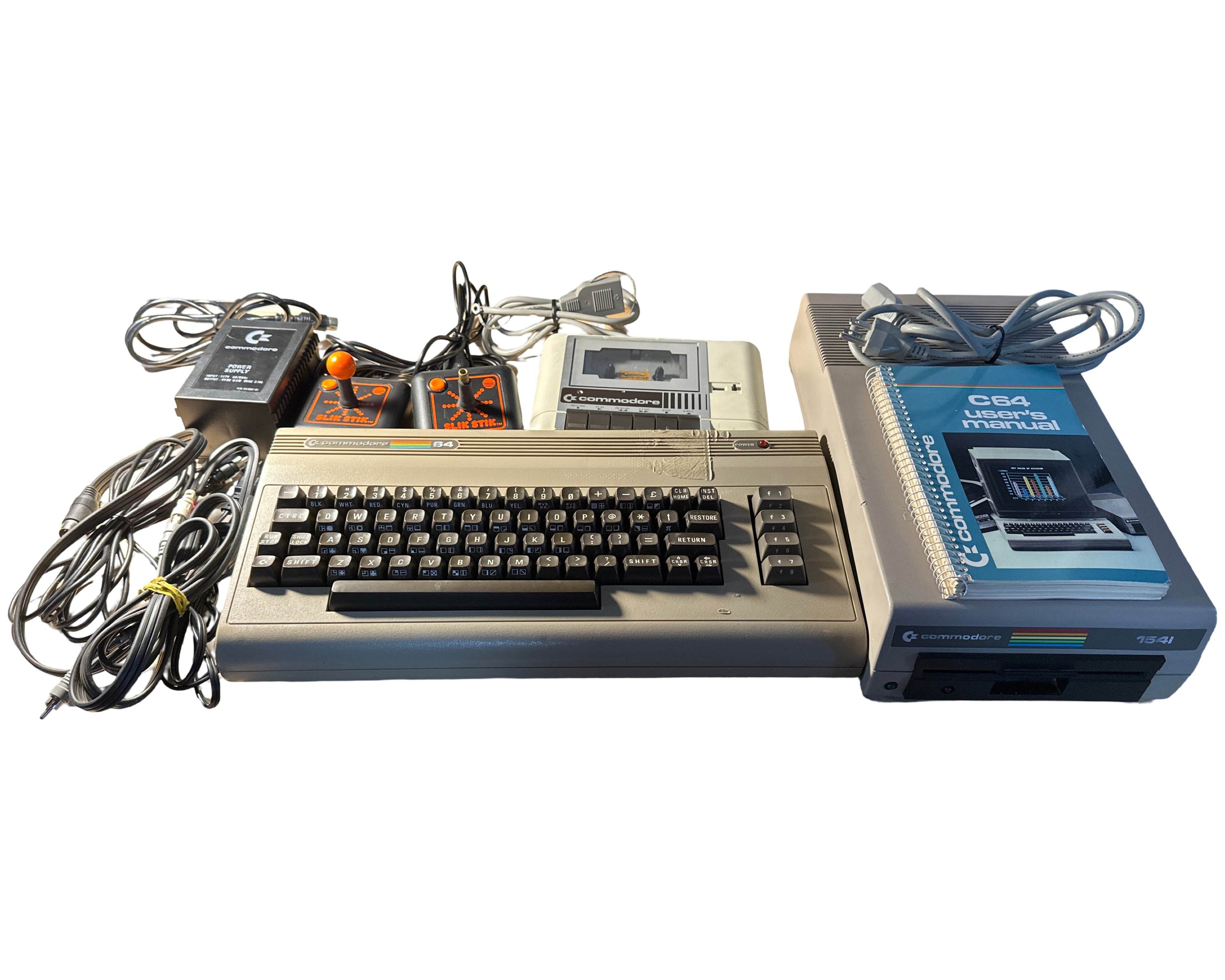 Commodore 64 System - USER MANUAL - 1541 DISC DRIVE - DATASSETTE - 2 CONTROLLERS