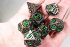 Gun Metal Hollow Gear Dice with Green Numbers 7-Dice Set - 