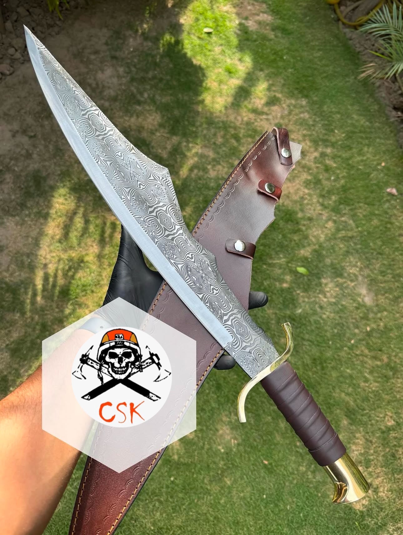 Spartan style sword with a leather-wrapped handle,Brass guard and pommel,Ornate patterned Blade