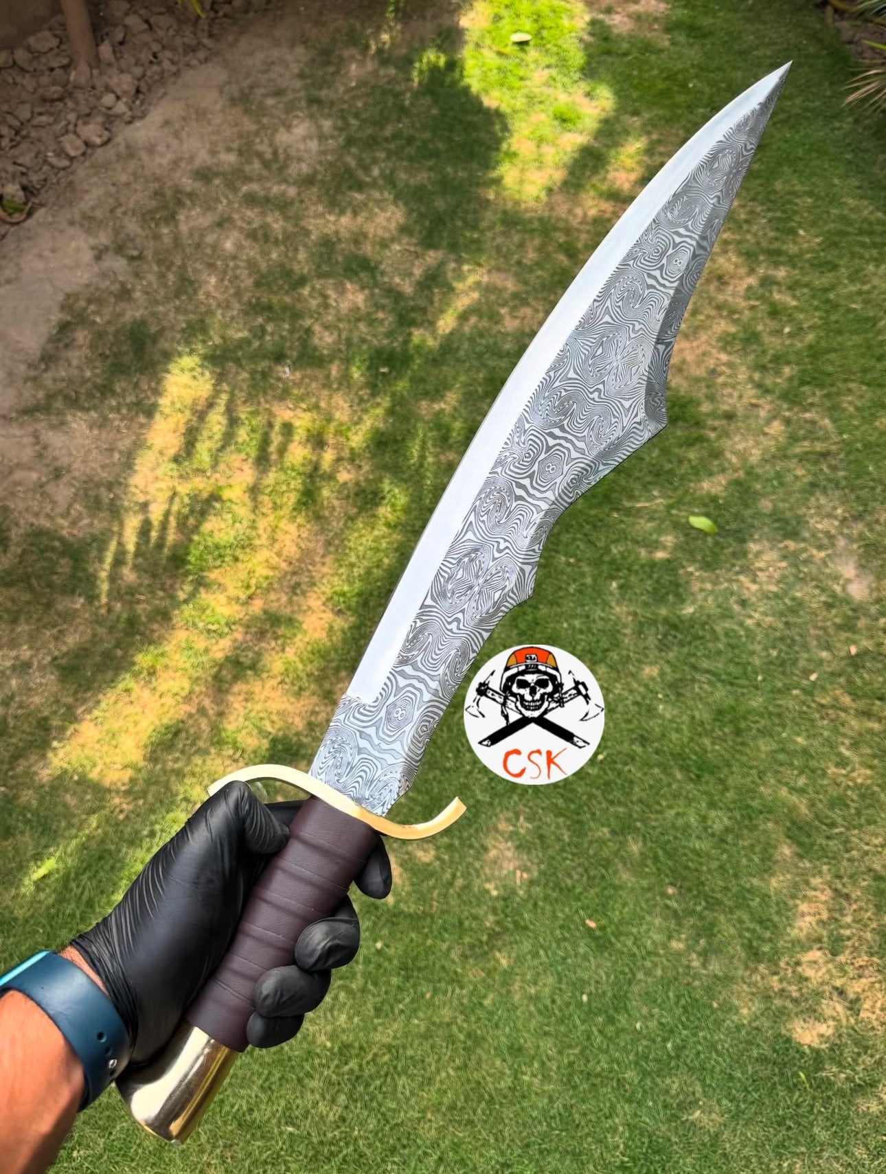 Spartan style sword with a leather-wrapped handle,Brass guard and pommel,Ornate patterned Blade