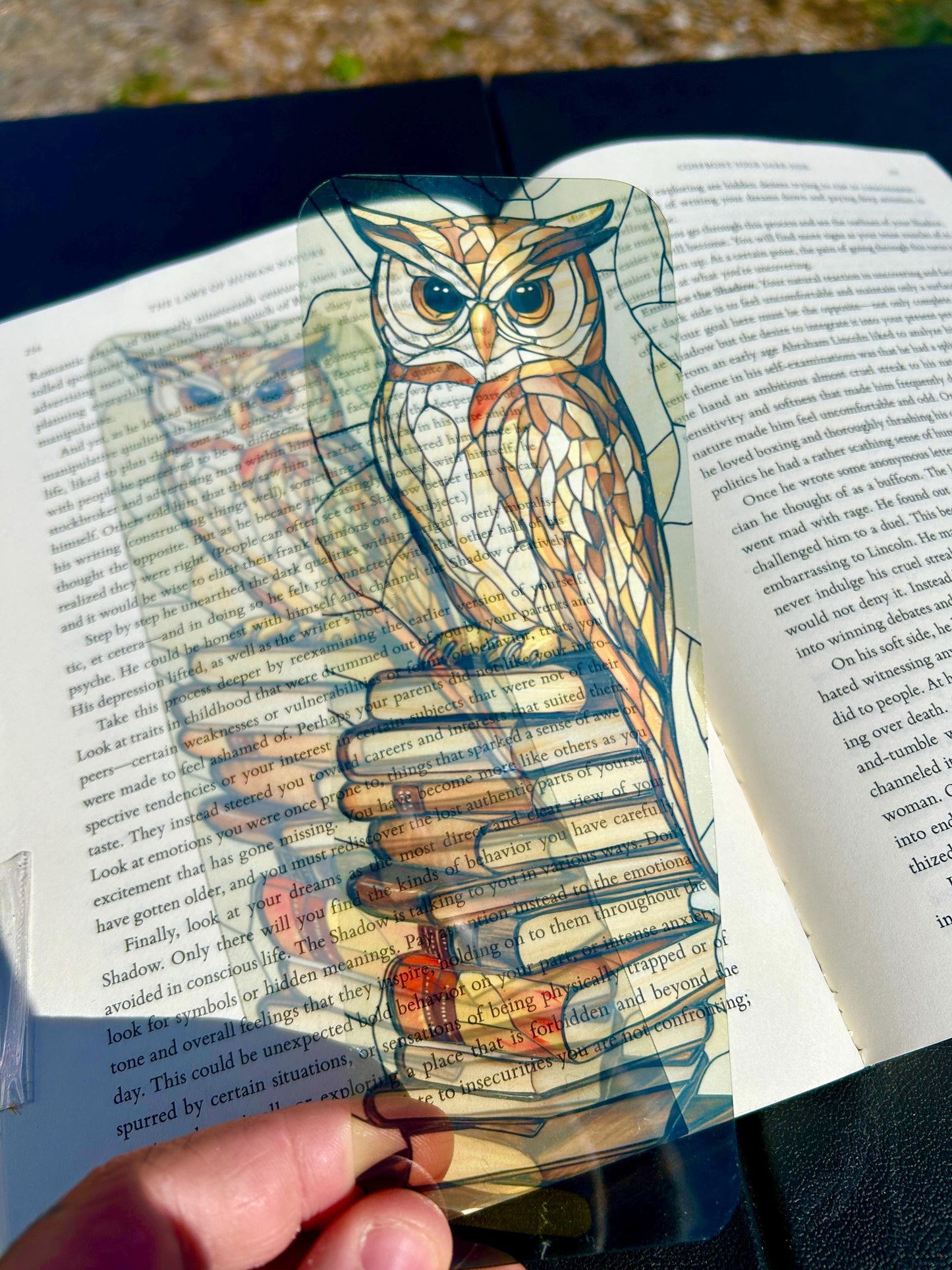 Stained glass owl bookmark with vintage book stack, wise brown owl perched on books