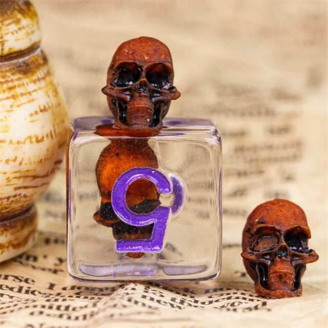 Orange Skull Dice | Clear RPG 7-Dice Set w/ Purple Numbers - 