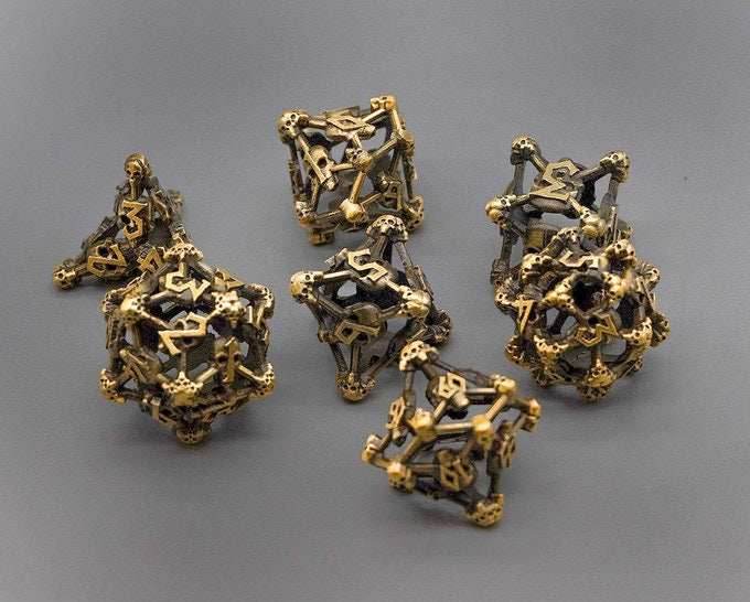 Gold Deadly Skull Dice Hollow Metal 7-Dice Set - 7-Dice Set