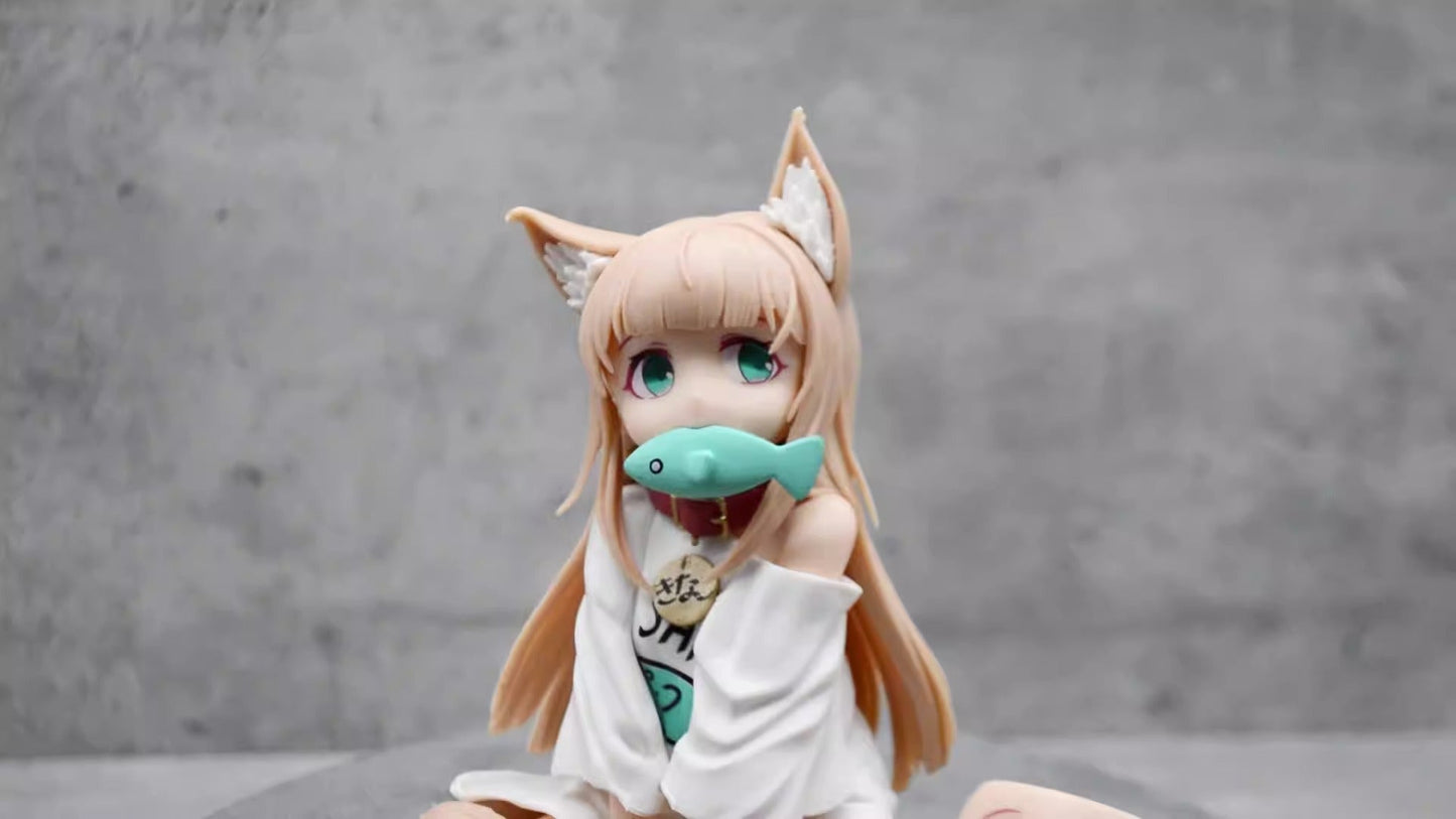 Cat girl sitting and eating fish figure