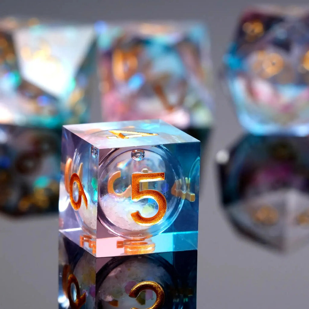 Transparent powder blue resin sequin liquid core dice set with gold numbers