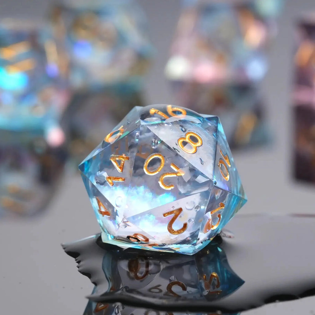 Transparent powder blue resin sequin liquid core dice set with gold numbers