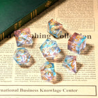 Transparent powder blue resin sequin liquid core dice set with gold numbers