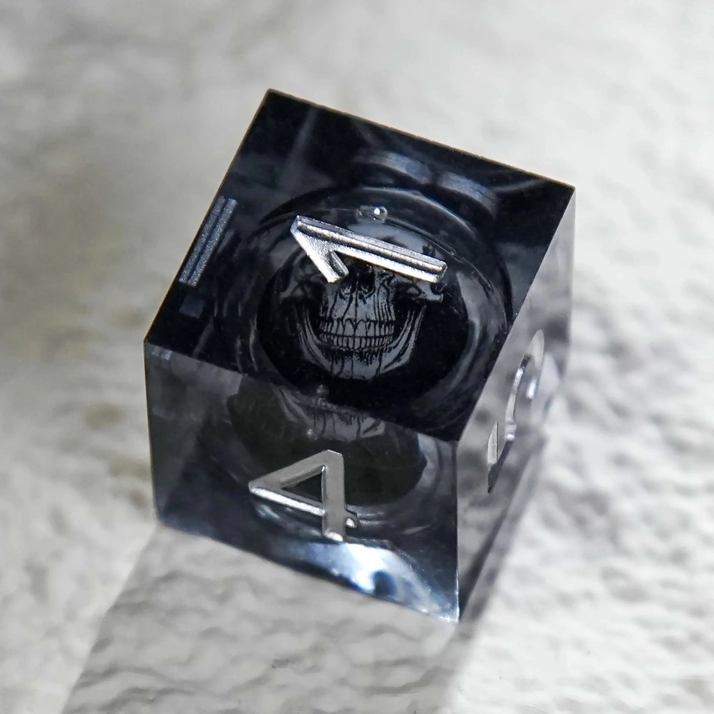 Dark Sorcerer's Skull Frame Liquid Core Resin Dice Set Silver Font