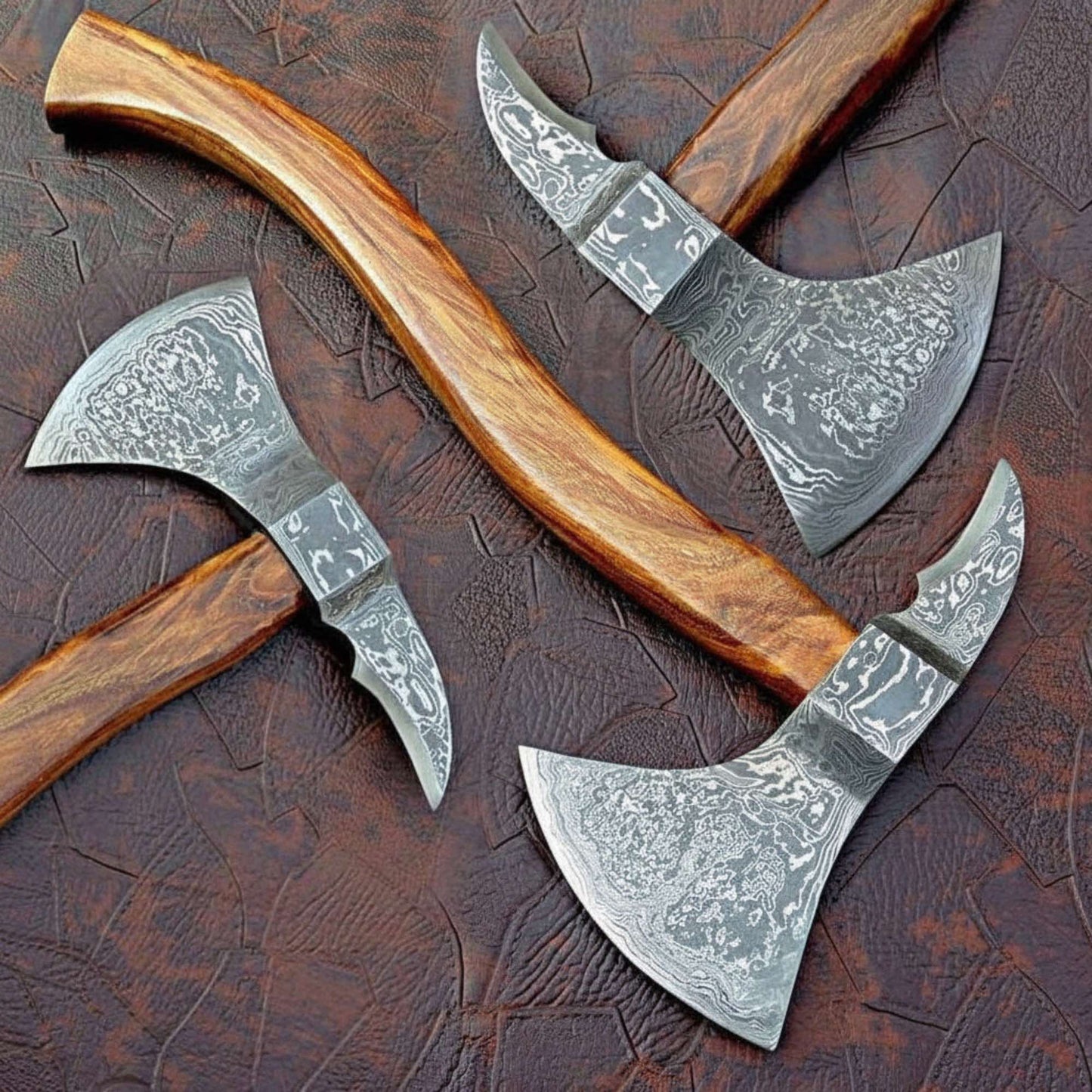 Traditional Norse axe featuring Damascus Heads and Sculpted Hardwood Shafts