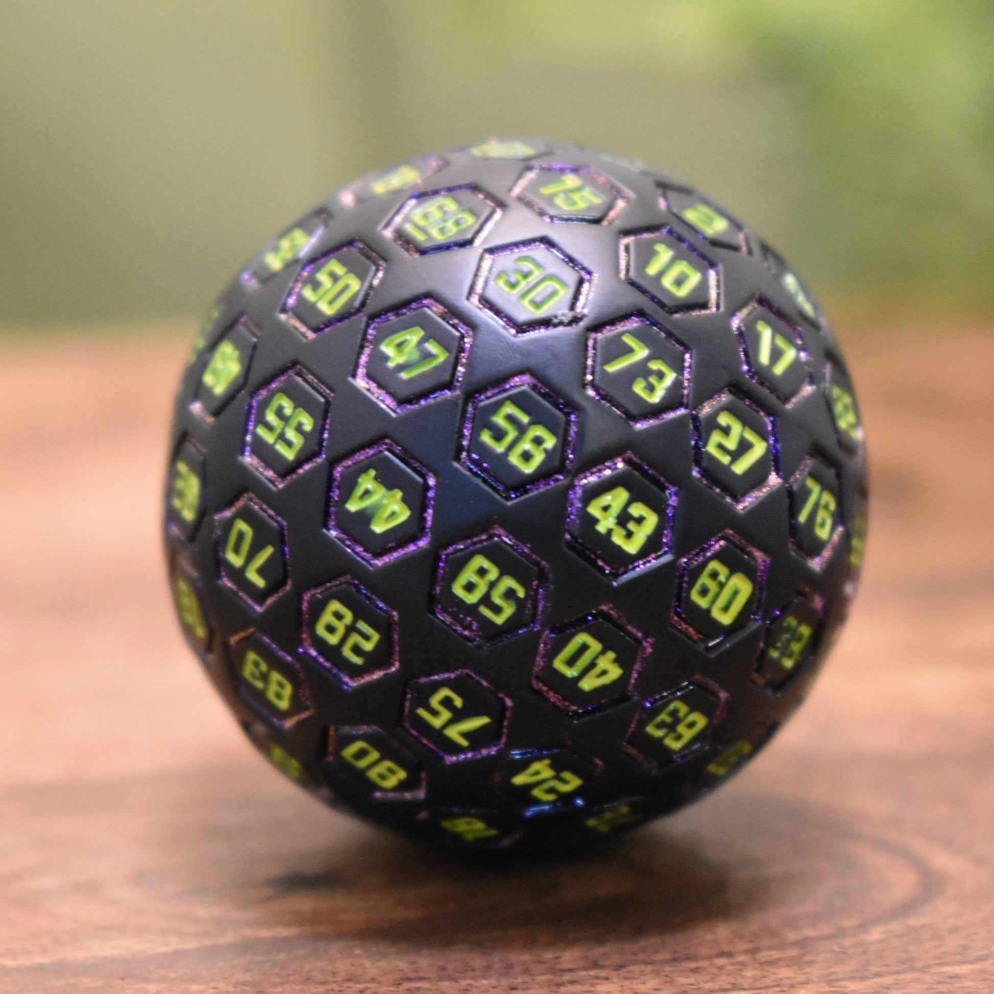 The Orb D100 -  Purple, Neon Green, and Black Metal Die