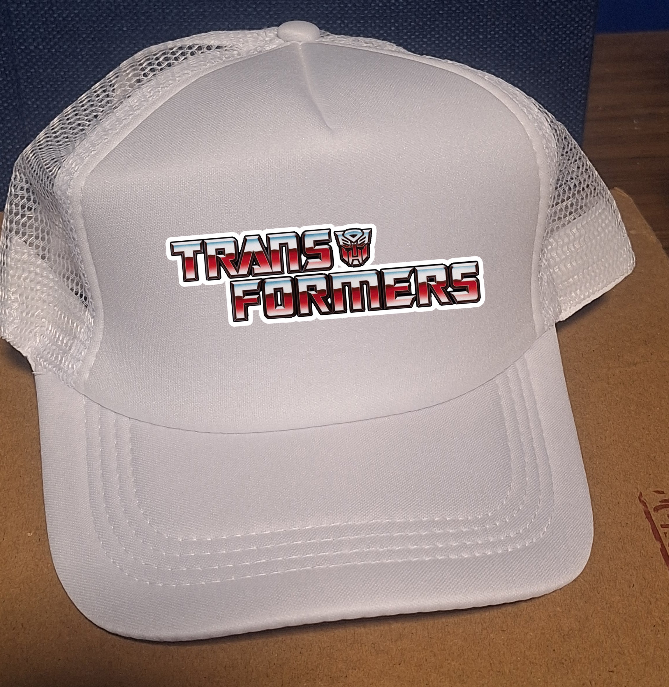Adjustable Trucker Baseball Cap Featuring Retro 1980s Transformers Cartoon Logo